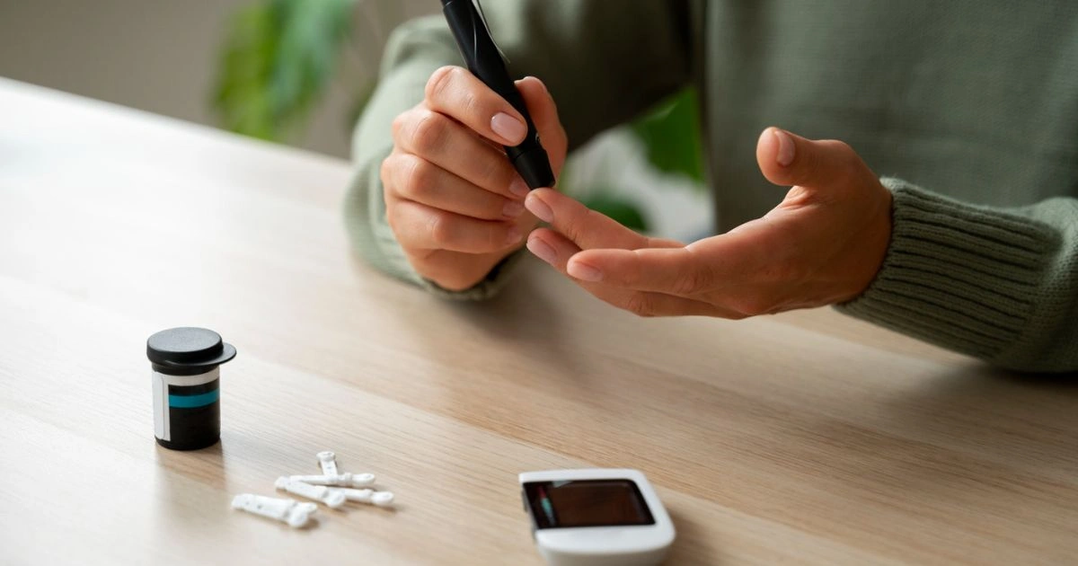 A person testing blood sugar levels with a glucometer